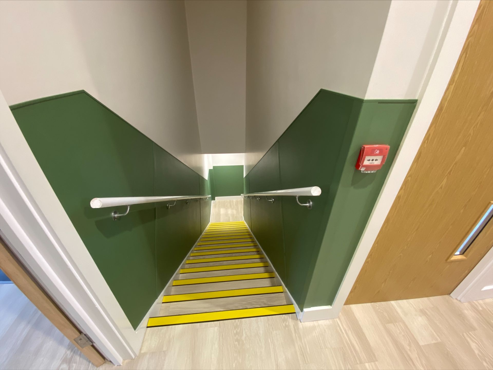 Gorcott Hill Park, A staircase with green walls and yellow steps leading up to the second floor.