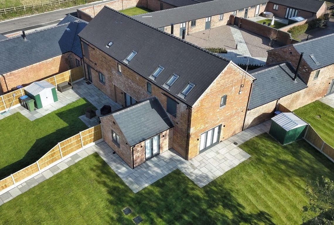 Newbold Farm,  An aerial view of a row of houses in a residential area.