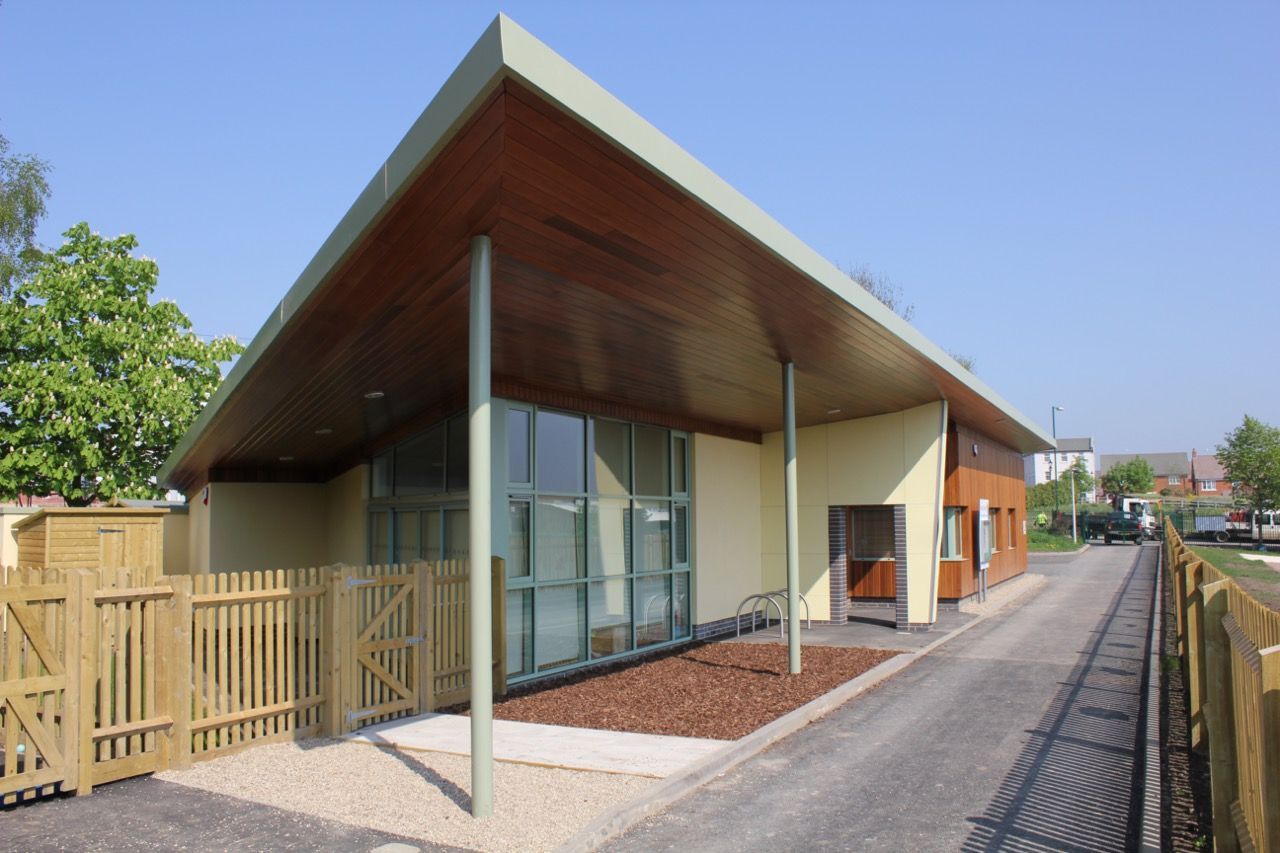 Shipstone, a small building with a wooden fence in front of it