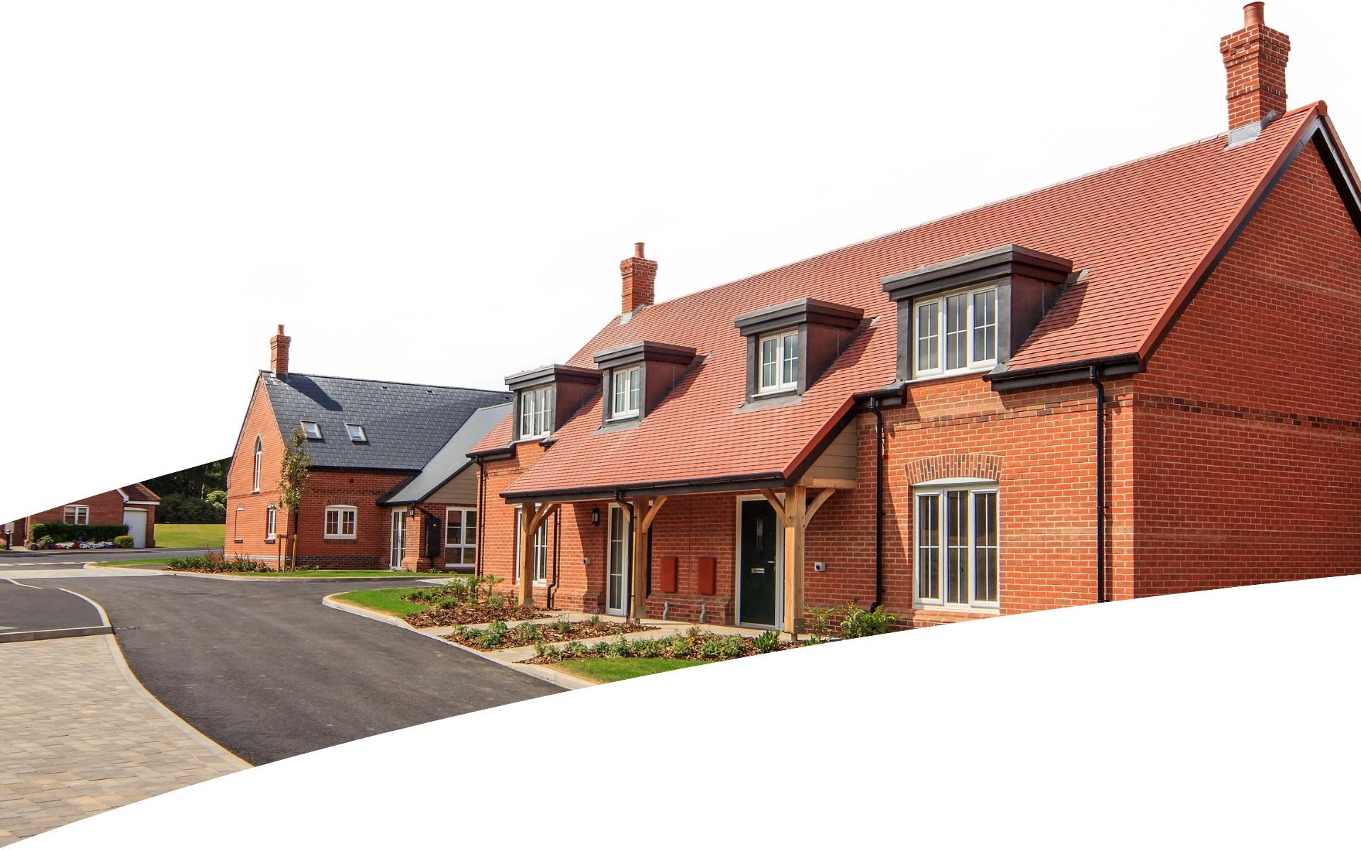 A row of brick houses with a red tile roof