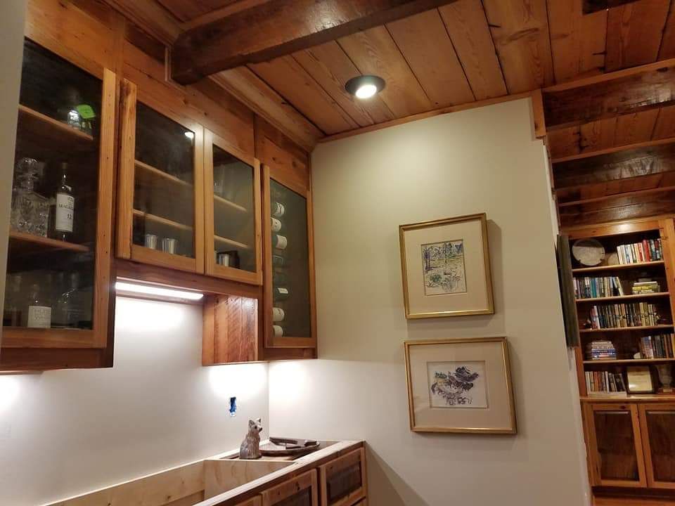 A kitchen with wooden cabinets and a sink