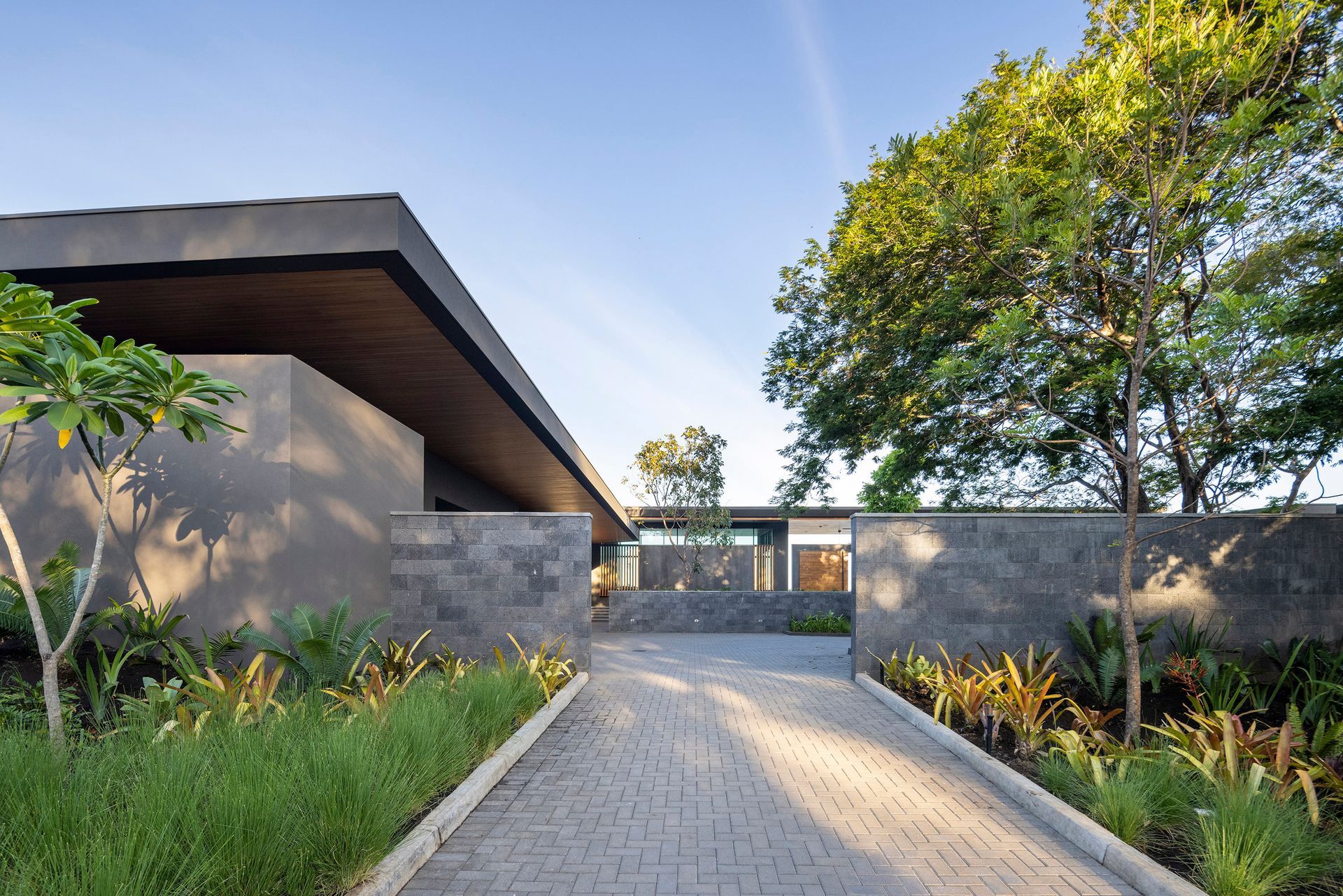 A sarco house surrounded by trees.