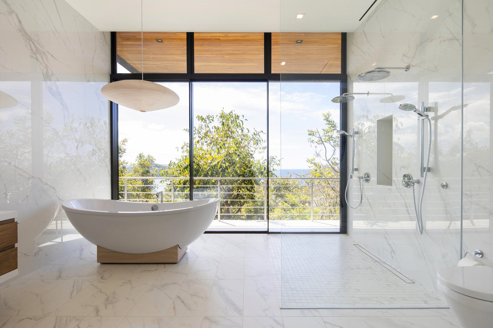 a bathroom with a bathtub and a walk in shower .