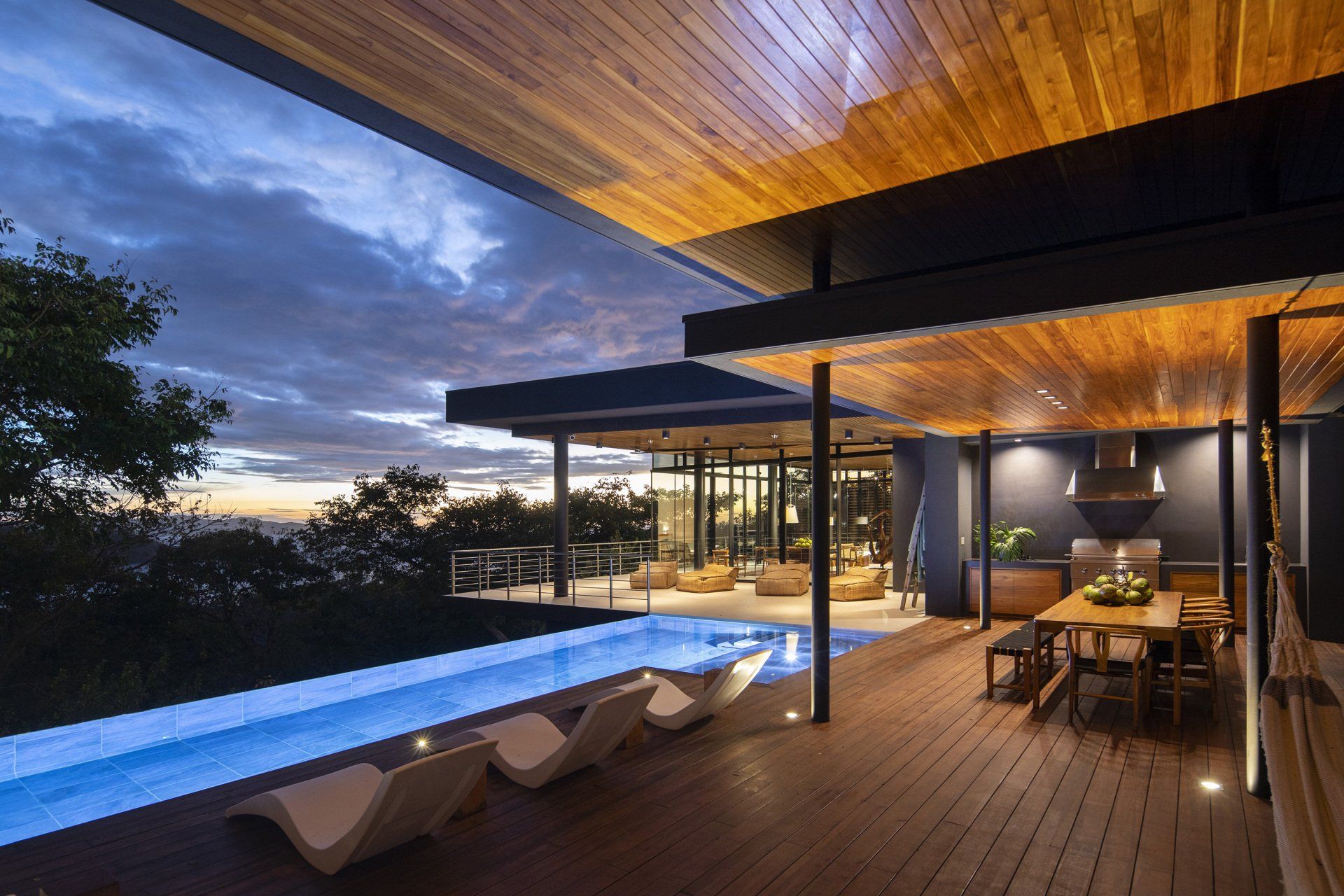 view from the patio of a modern Costa Rican cliff side home at dusk