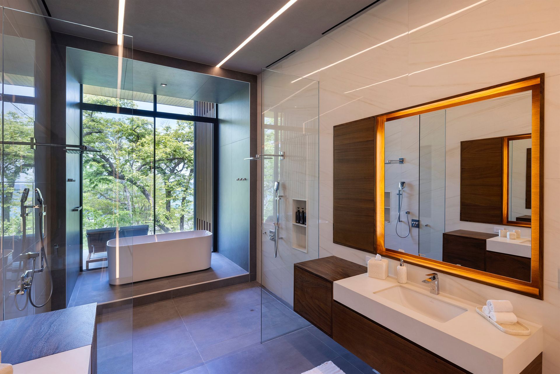 a bathroom with a large mirror and a bathtub .
