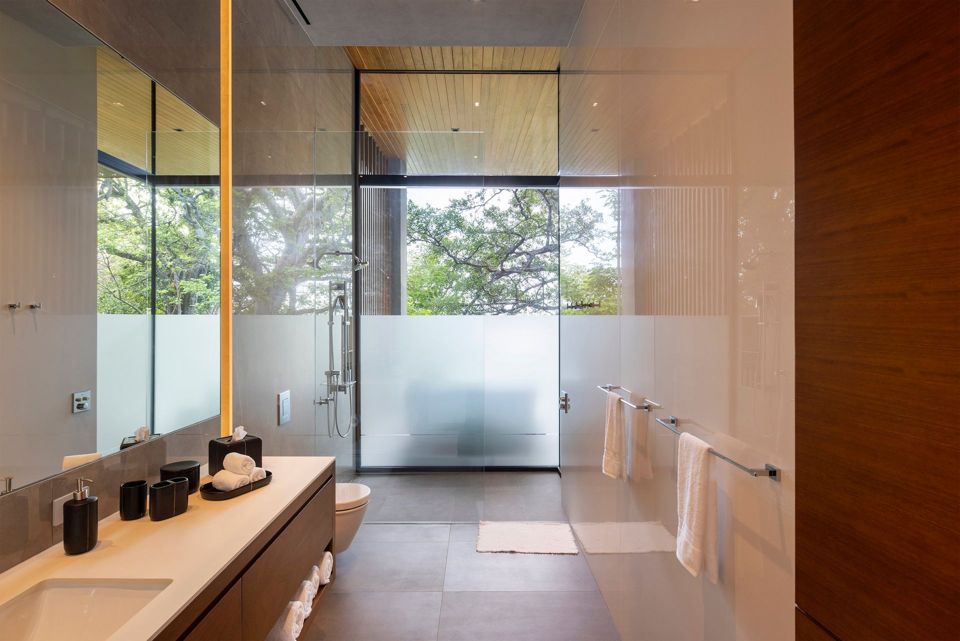 a bathroom with a sink and a walk in shower