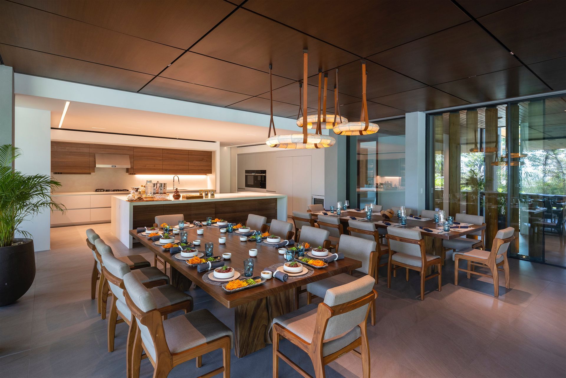 a large dining room with a long table and chairs