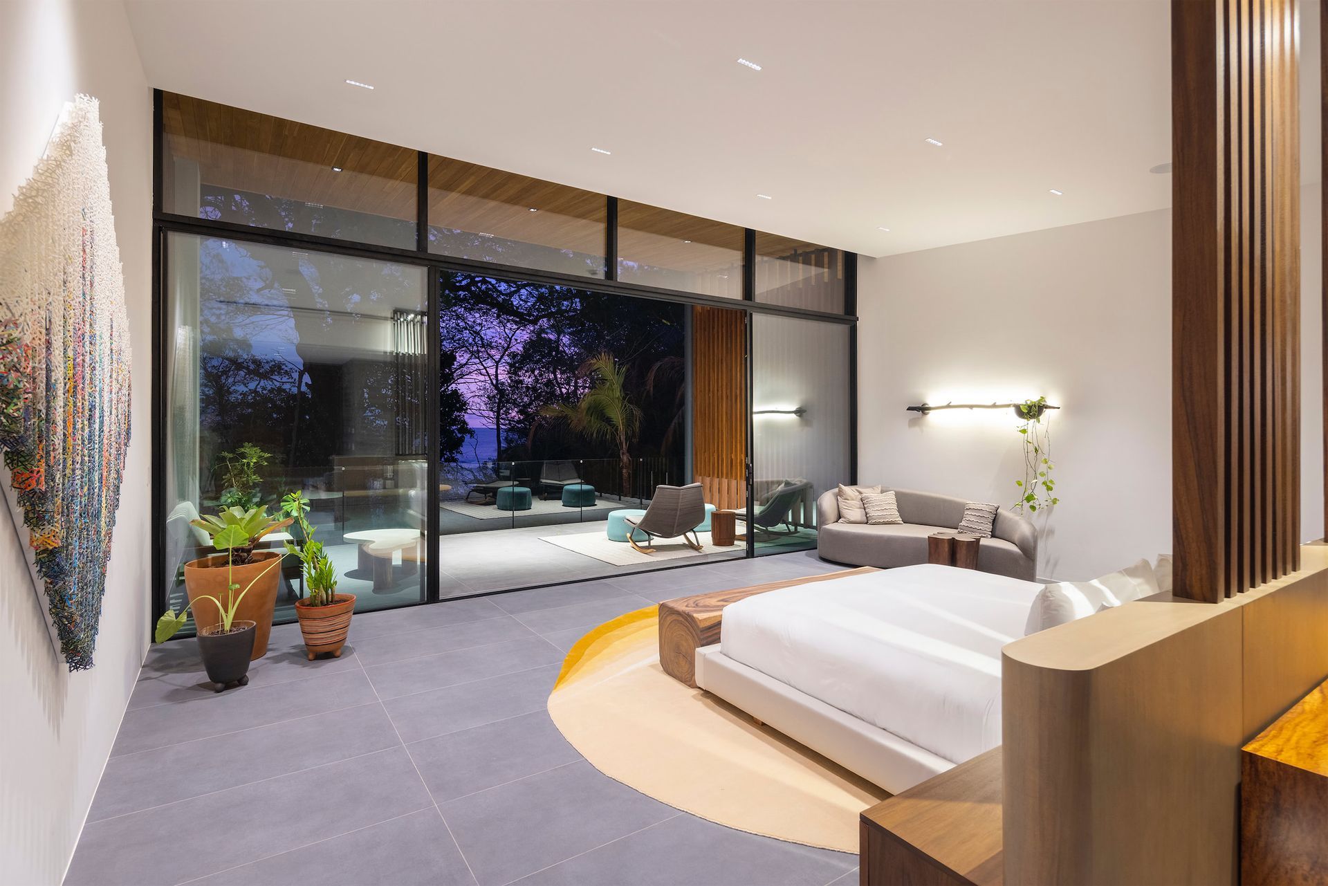 an artist 's impression of a bedroom with a large bed and a couch .