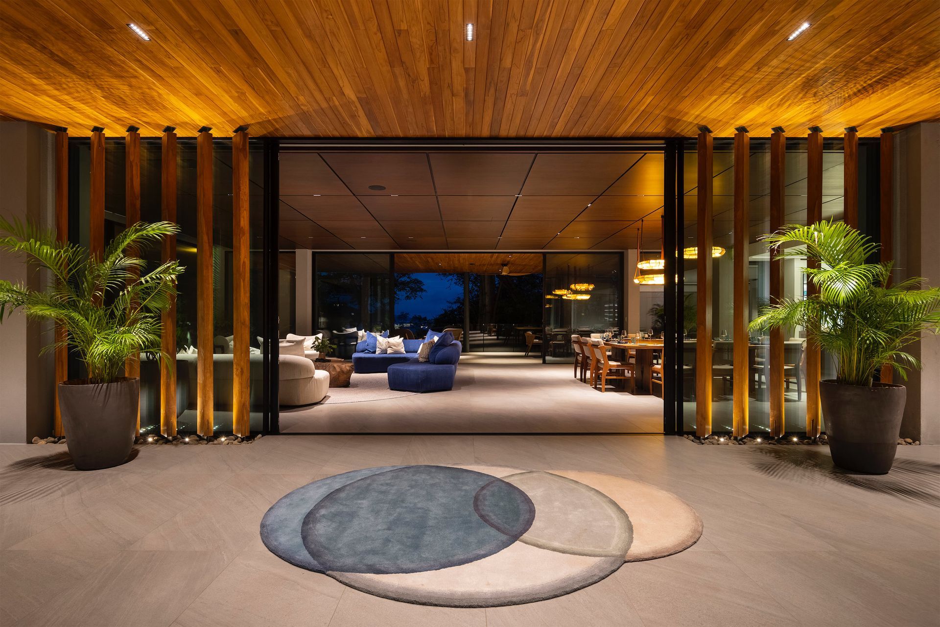 a living room with a circular rug in the middle