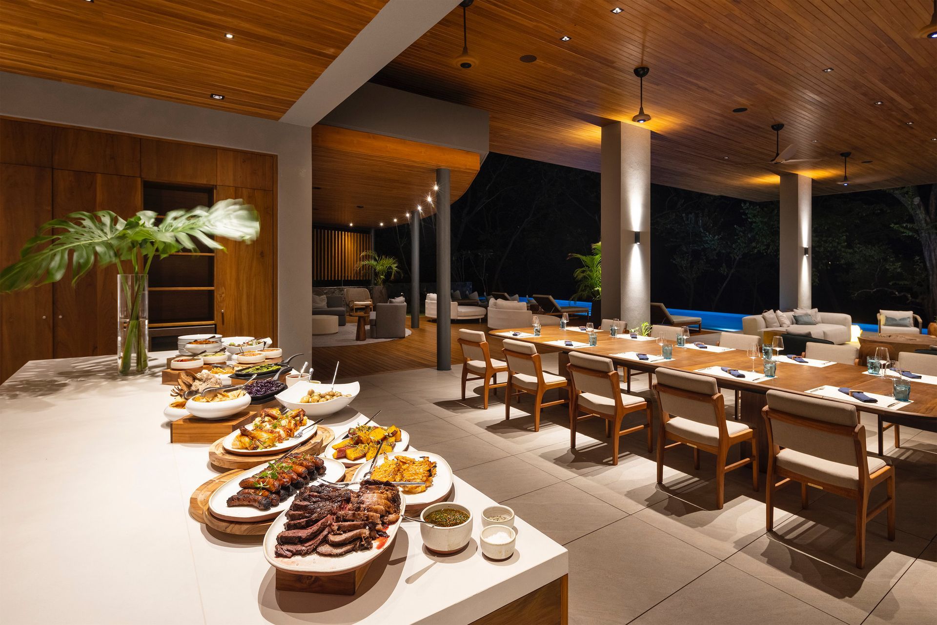 a large room with tables and chairs filled with food .