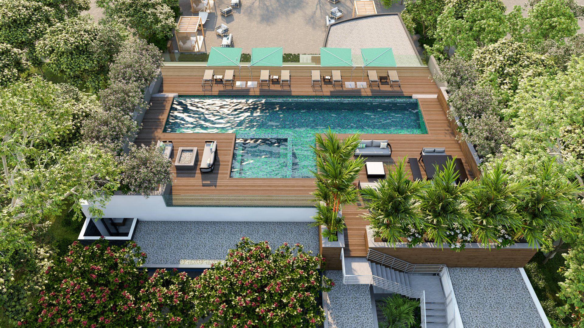 an aerial view of a swimming pool surrounded by trees and chairs .