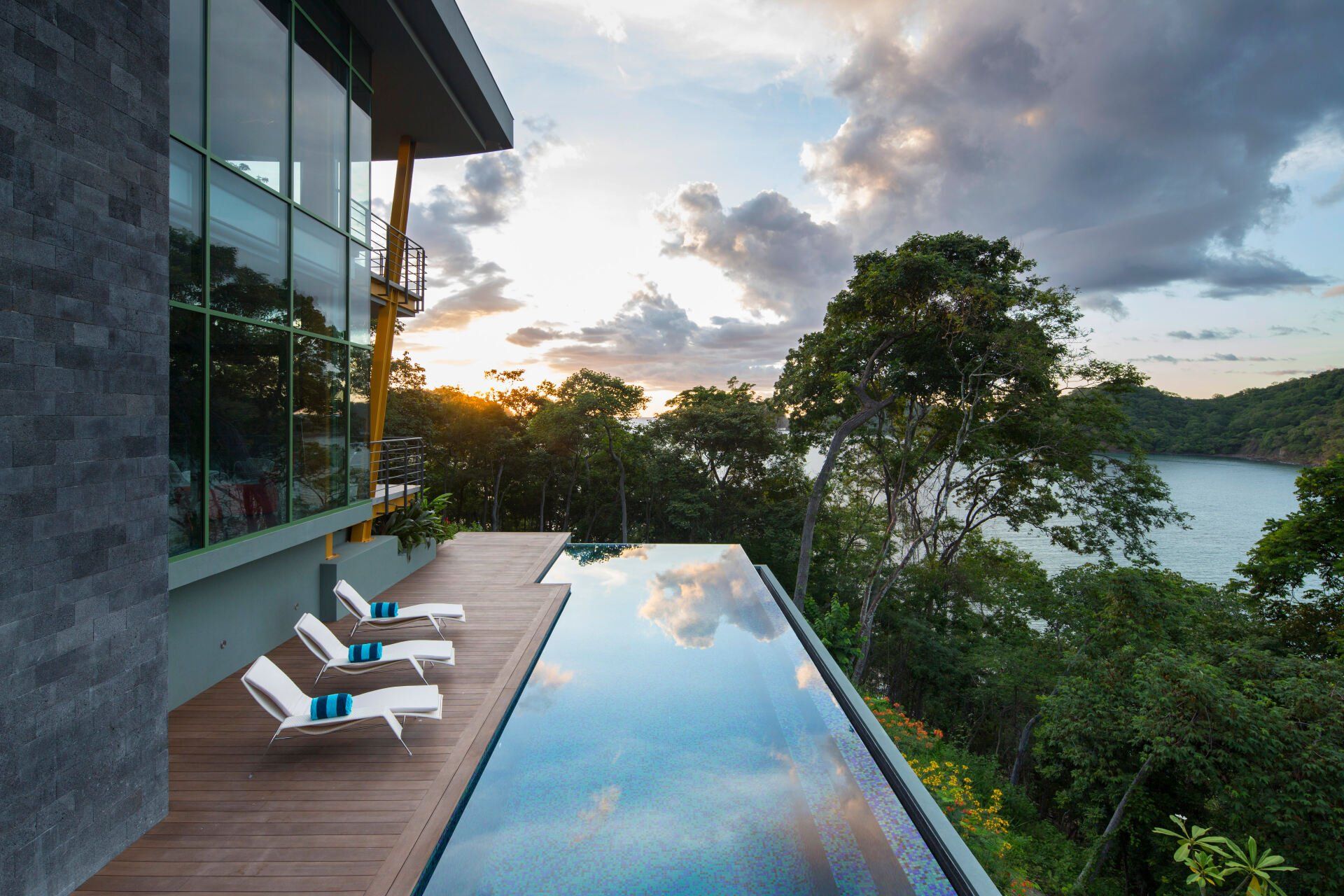 a swimming pool with a view of a lake and trees