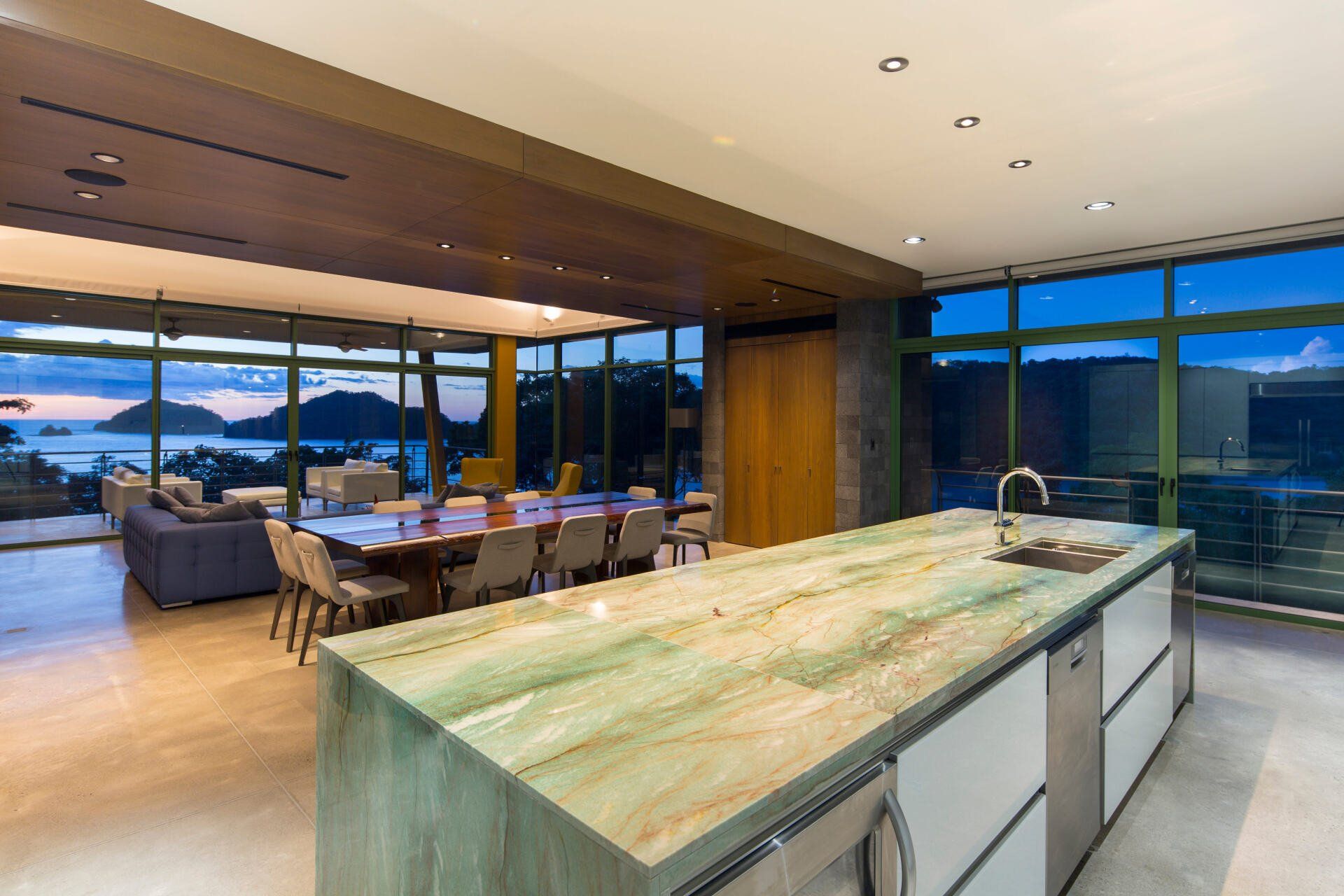 a kitchen with a large island in the middle of it