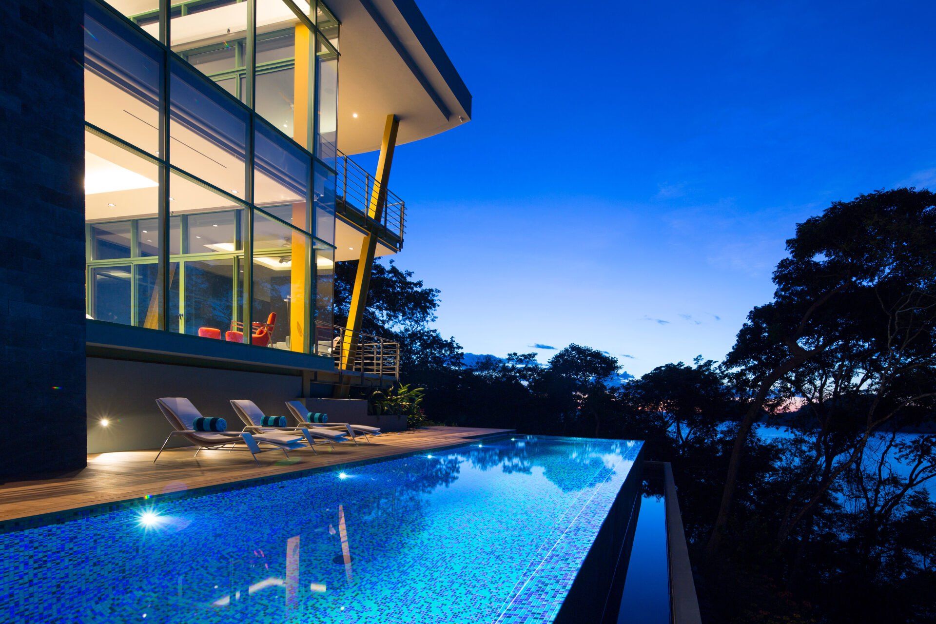 a large house with a swimming pool in front of it