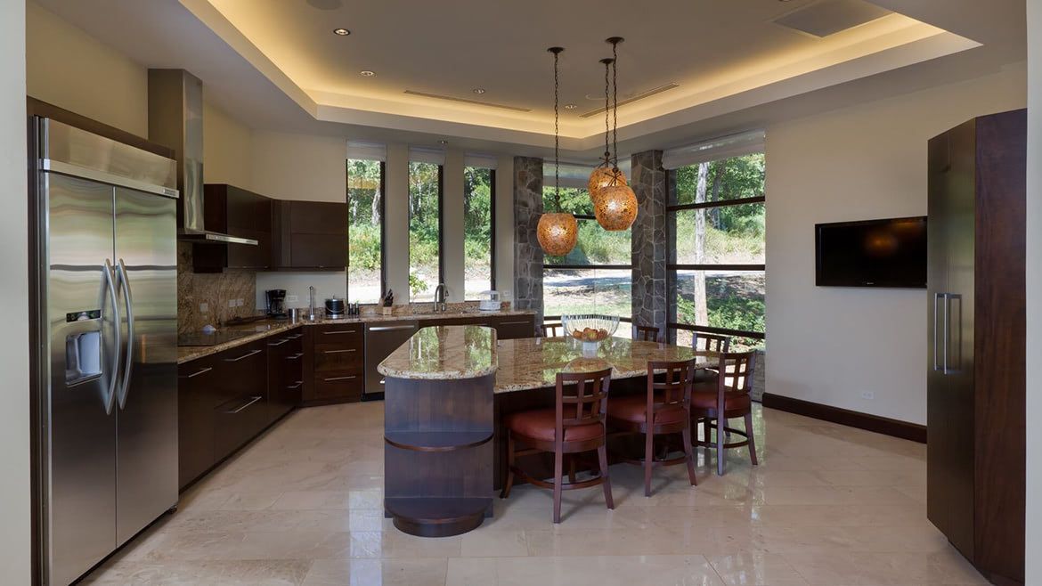 a kitchen with stainless steel appliances and a large island