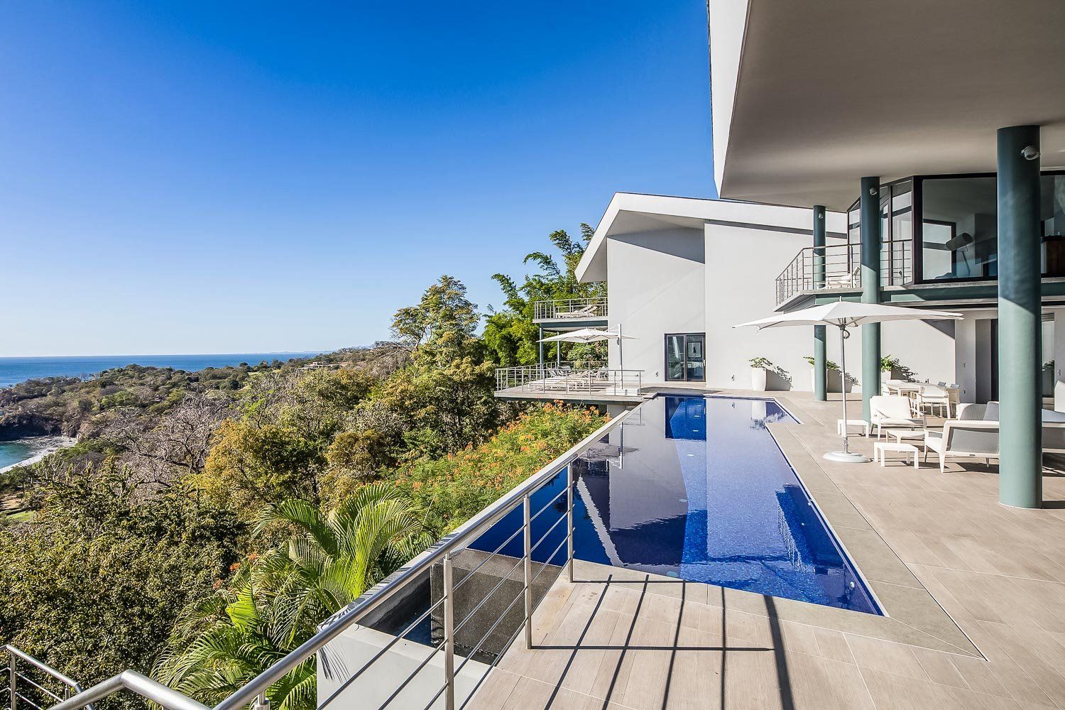 a large house with a swimming pool in front of it