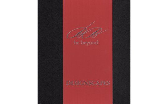 a red and black book with the words `` be beyond '' on it .