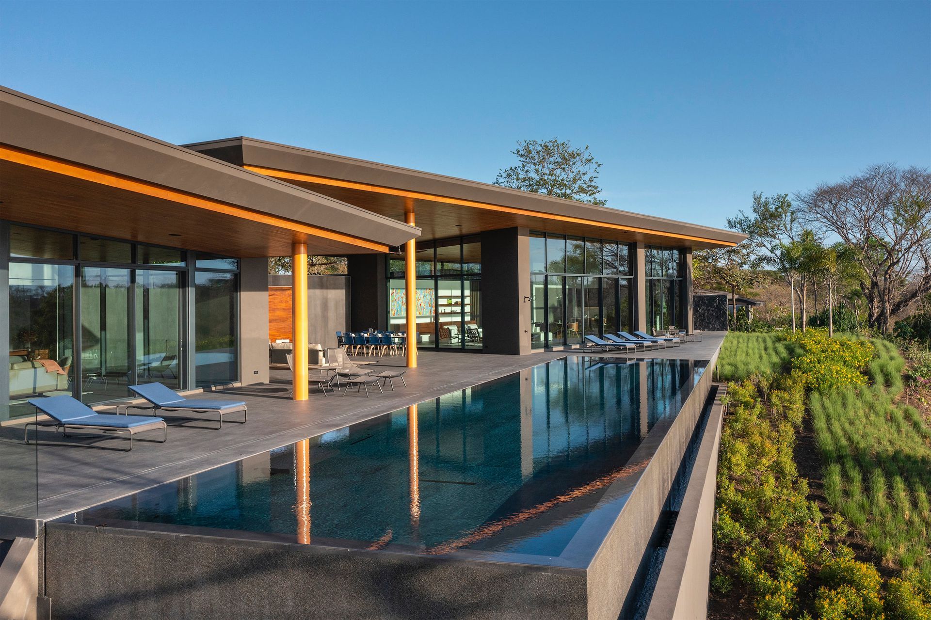 a large house with a large swimming pool in front of it .
