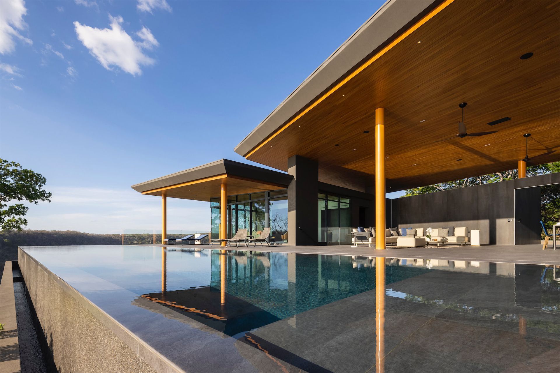 a large house with a swimming pool in front of it