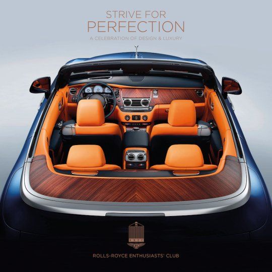 a blue rolls royce convertible with orange seats