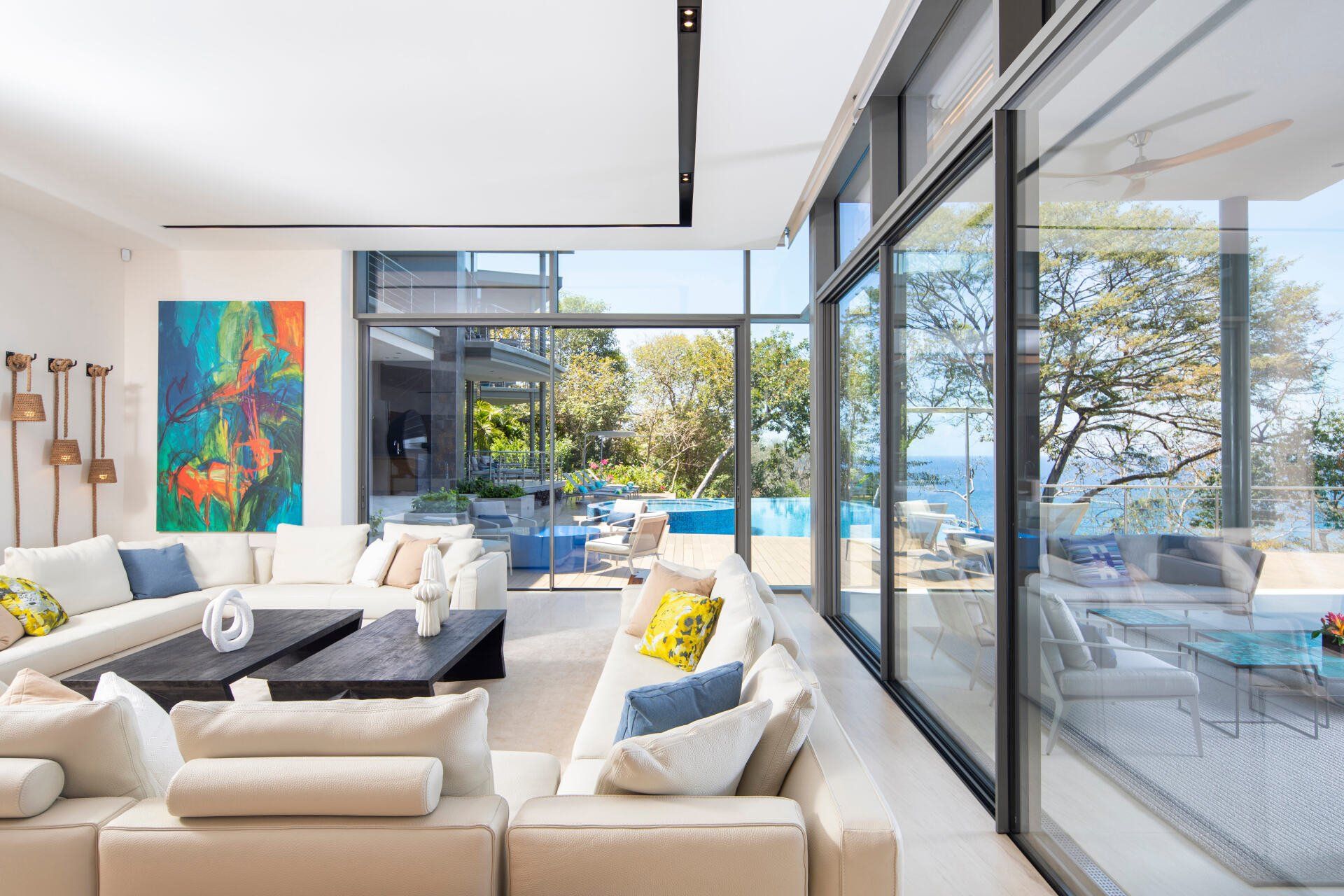 a living room with a lot of windows and a couch .