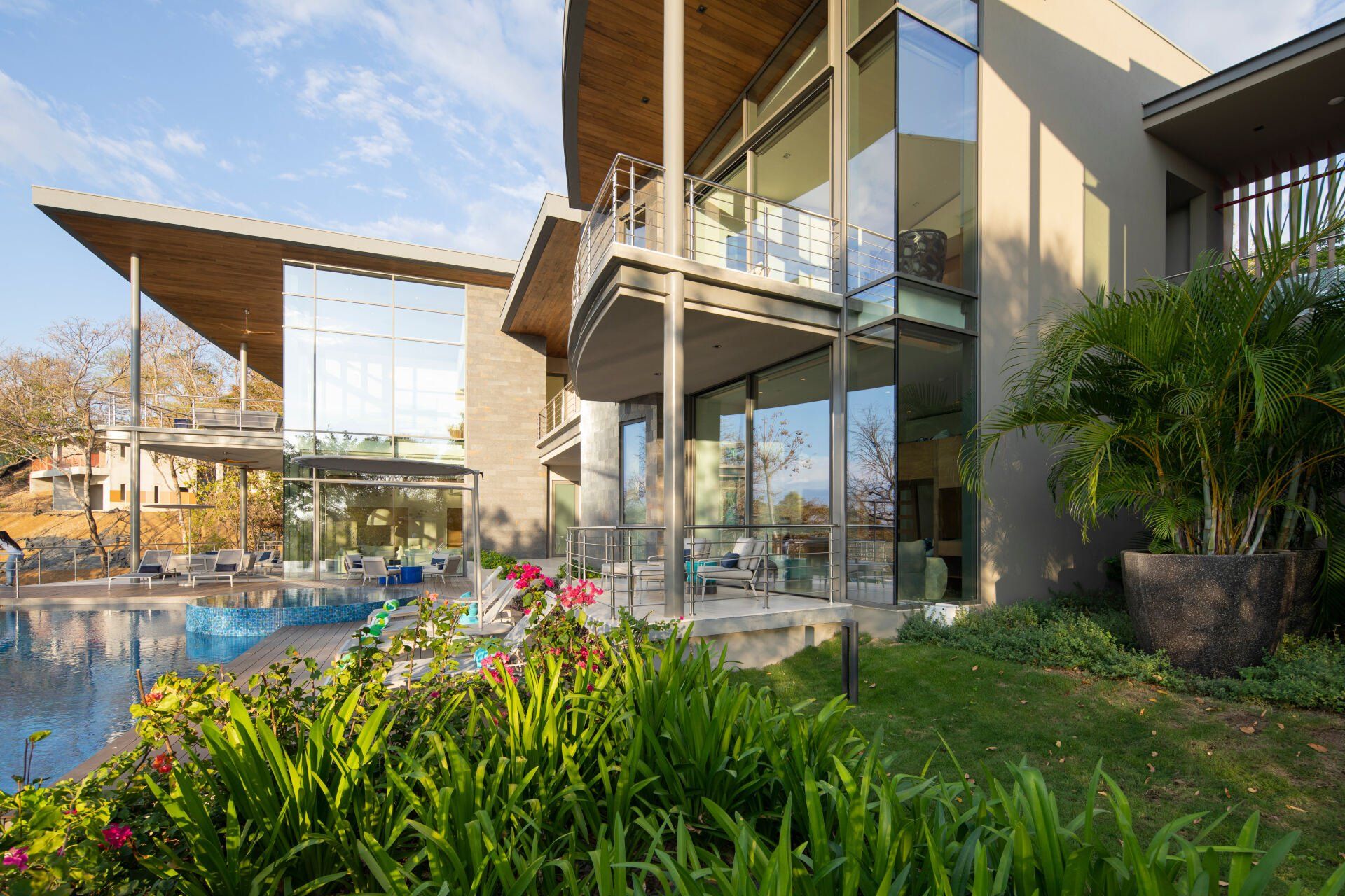 a large house with a swimming pool in front of it
