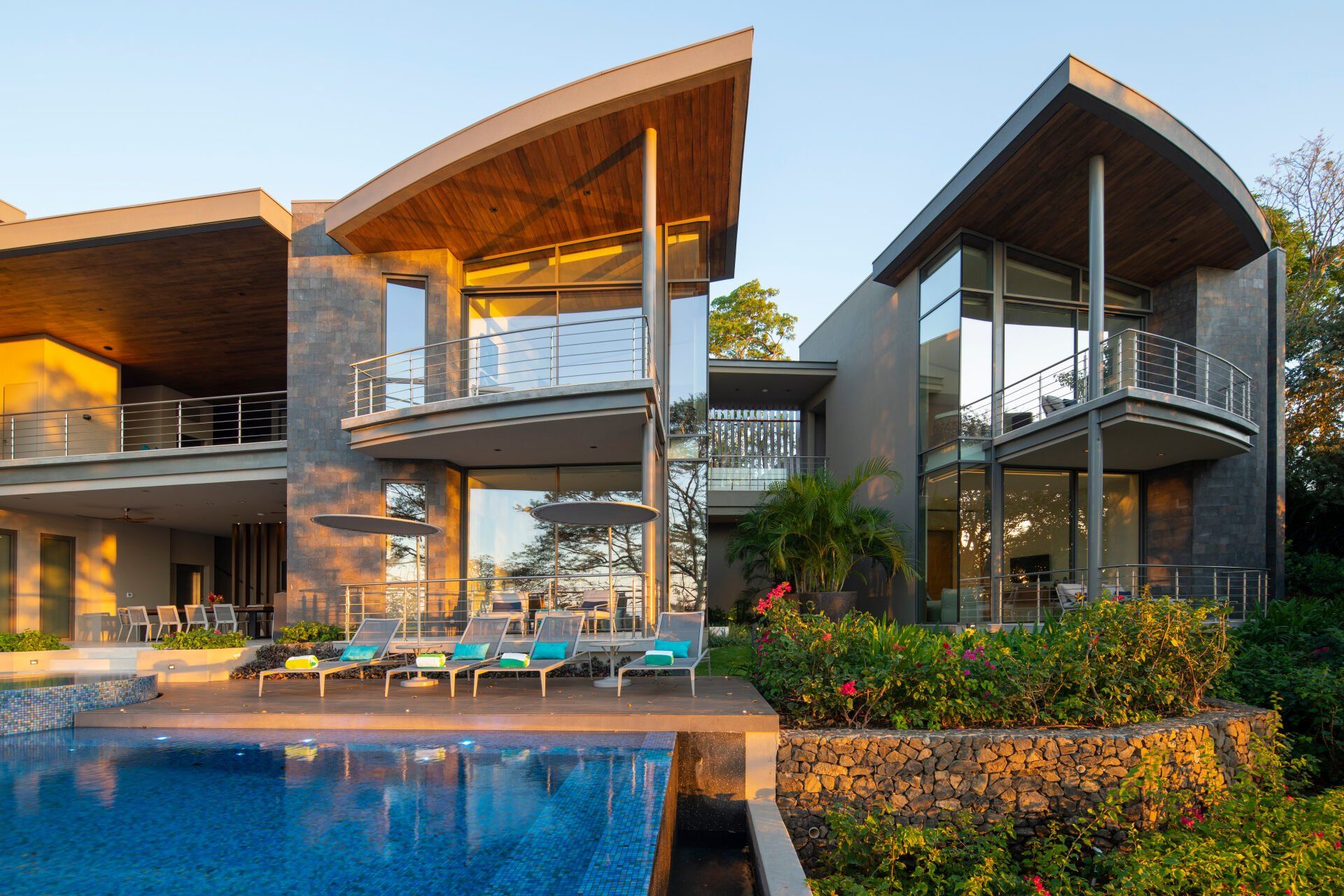 a large house with a swimming pool in front of it