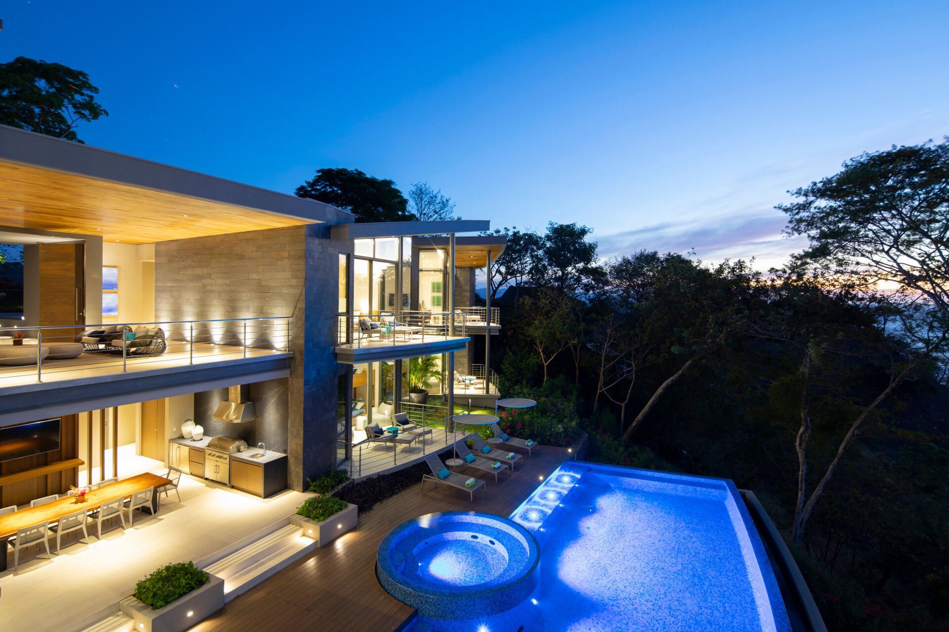 a large house with a swimming pool in front of it