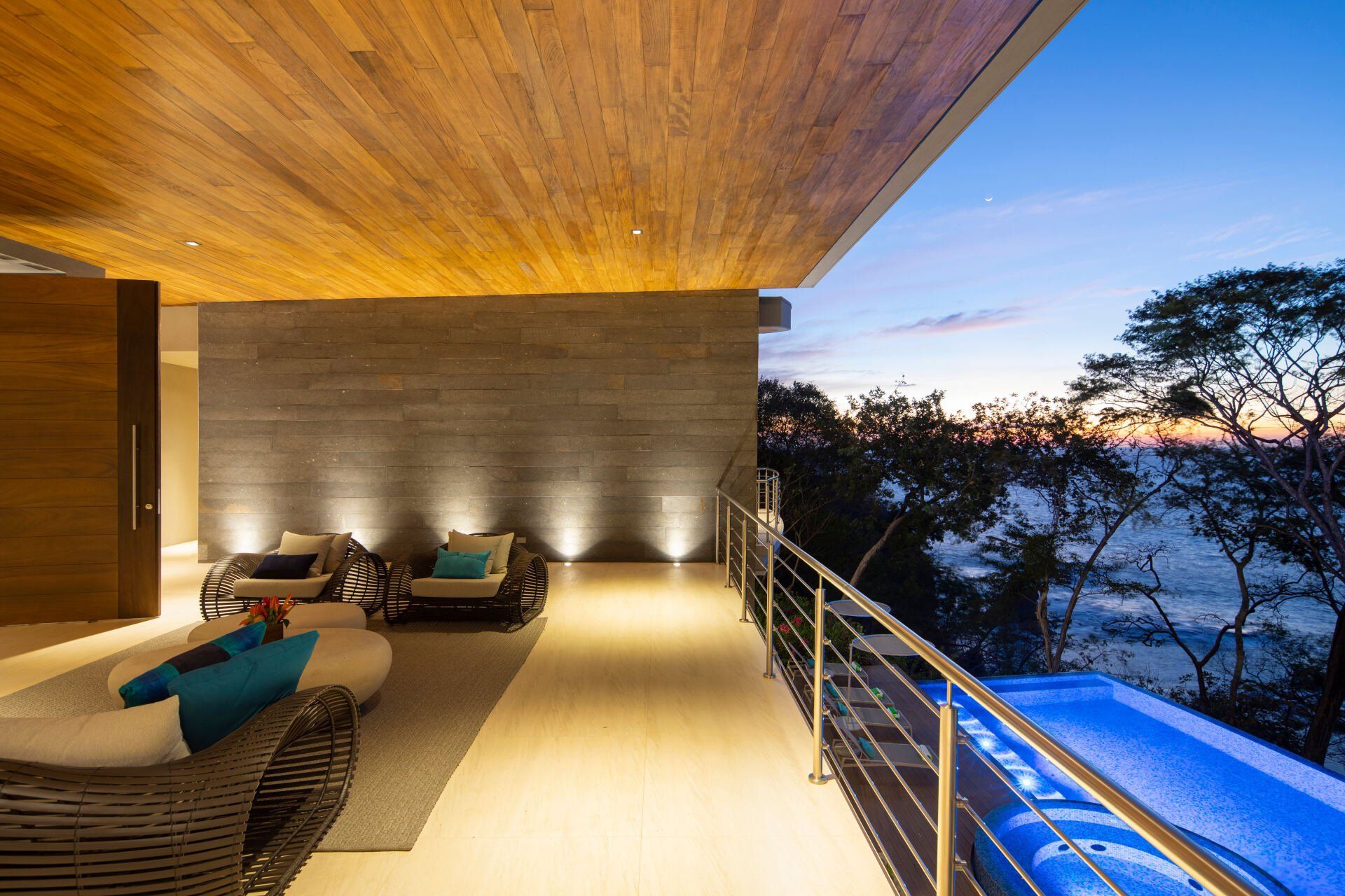 a living room with a swimming pool and a view of the ocean .
