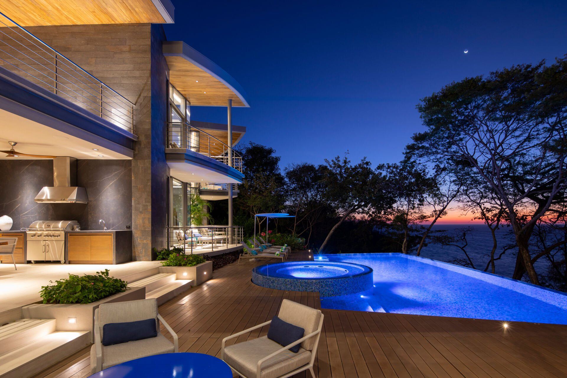 a large house with a swimming pool in front of it