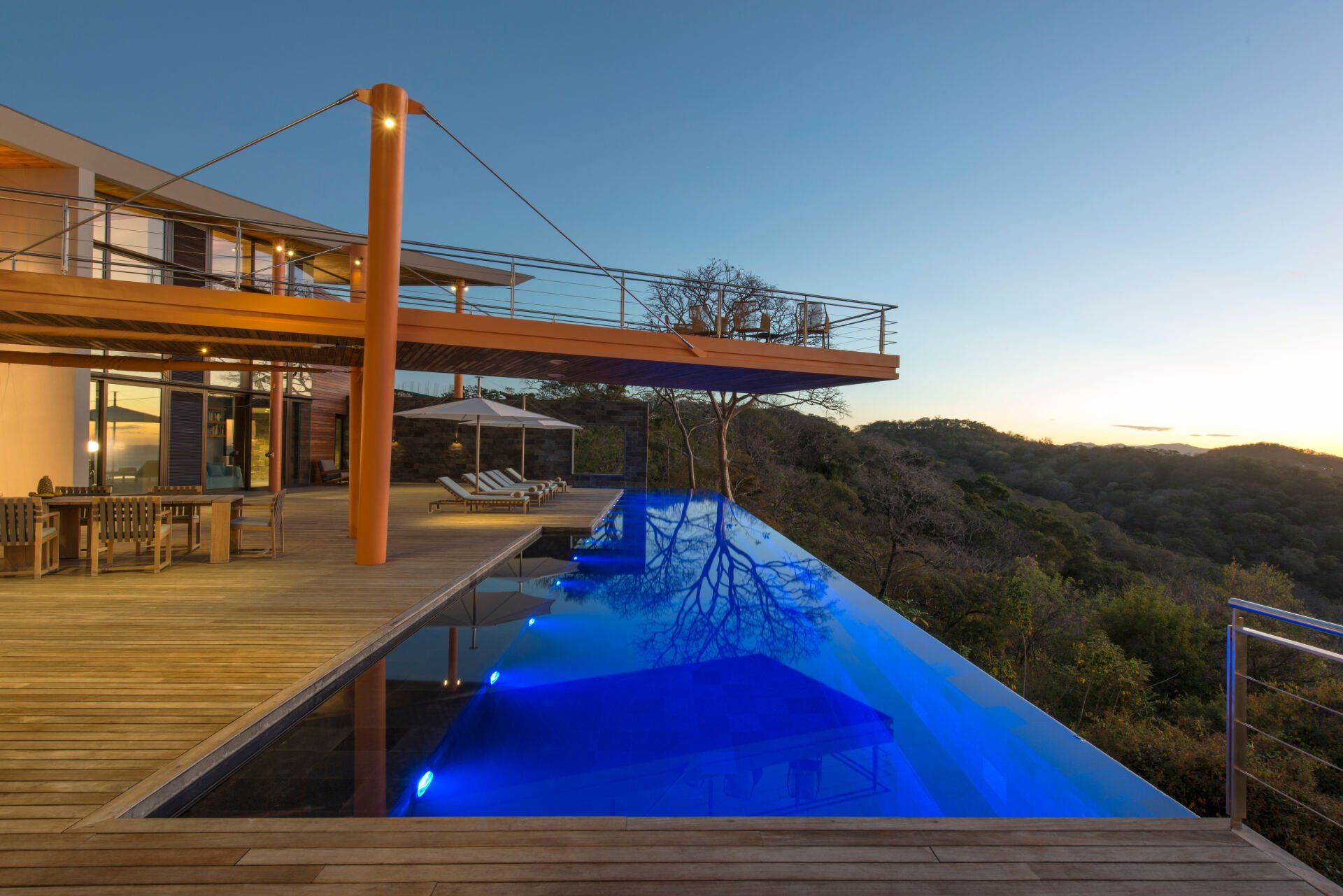 a large house with a swimming pool in front of it