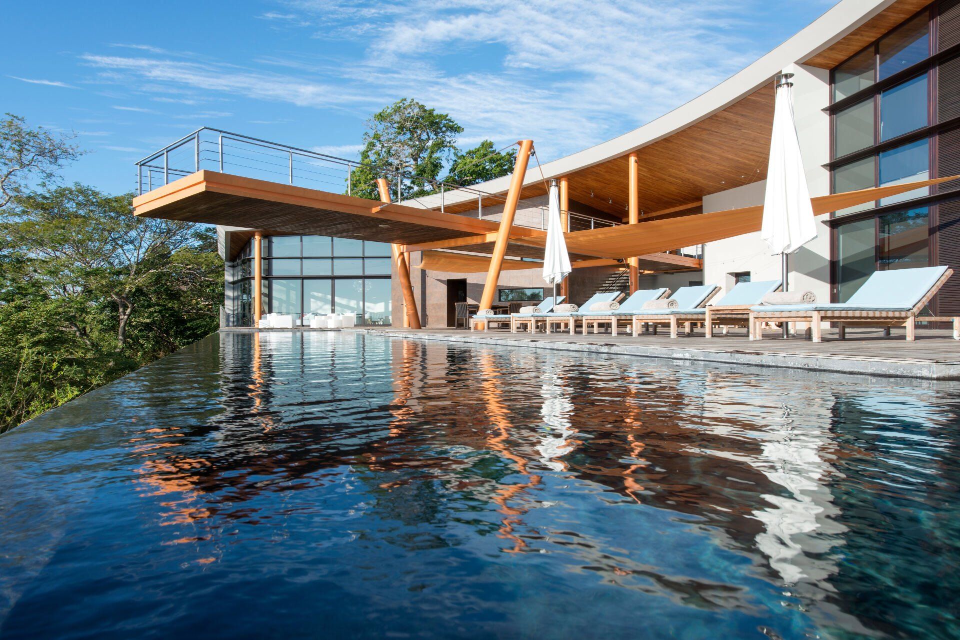 a large house with a swimming pool in front of it .