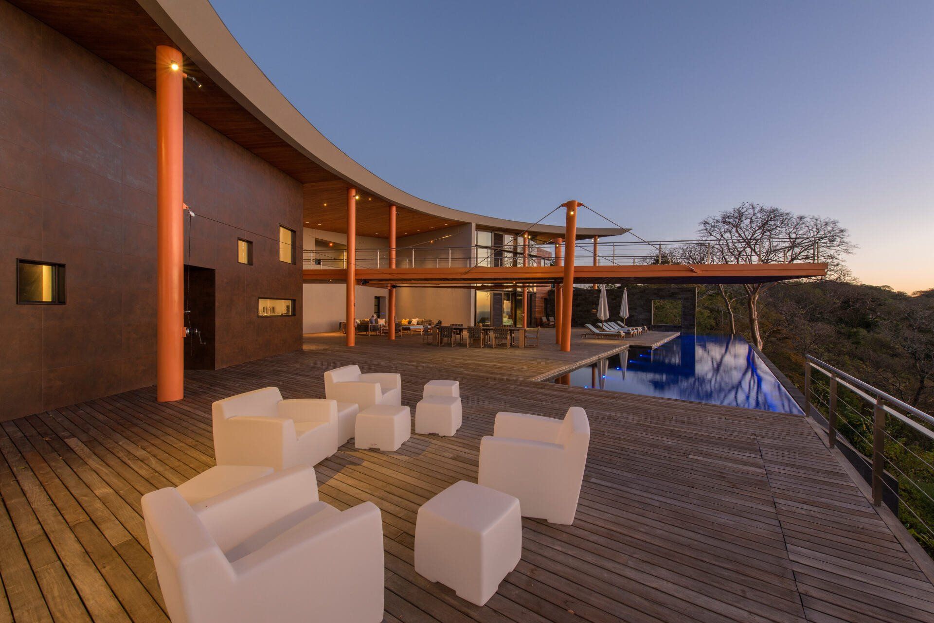 a large house with a swimming pool in front of it