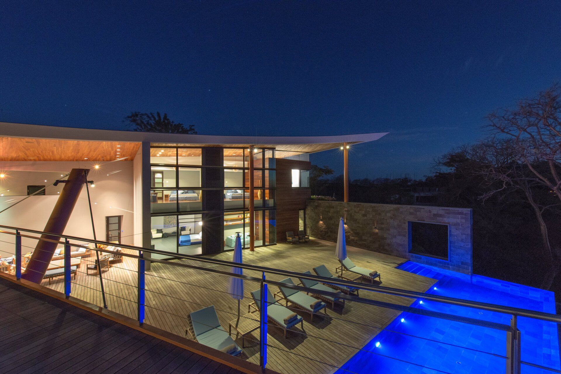 a large house with a swimming pool in front of it