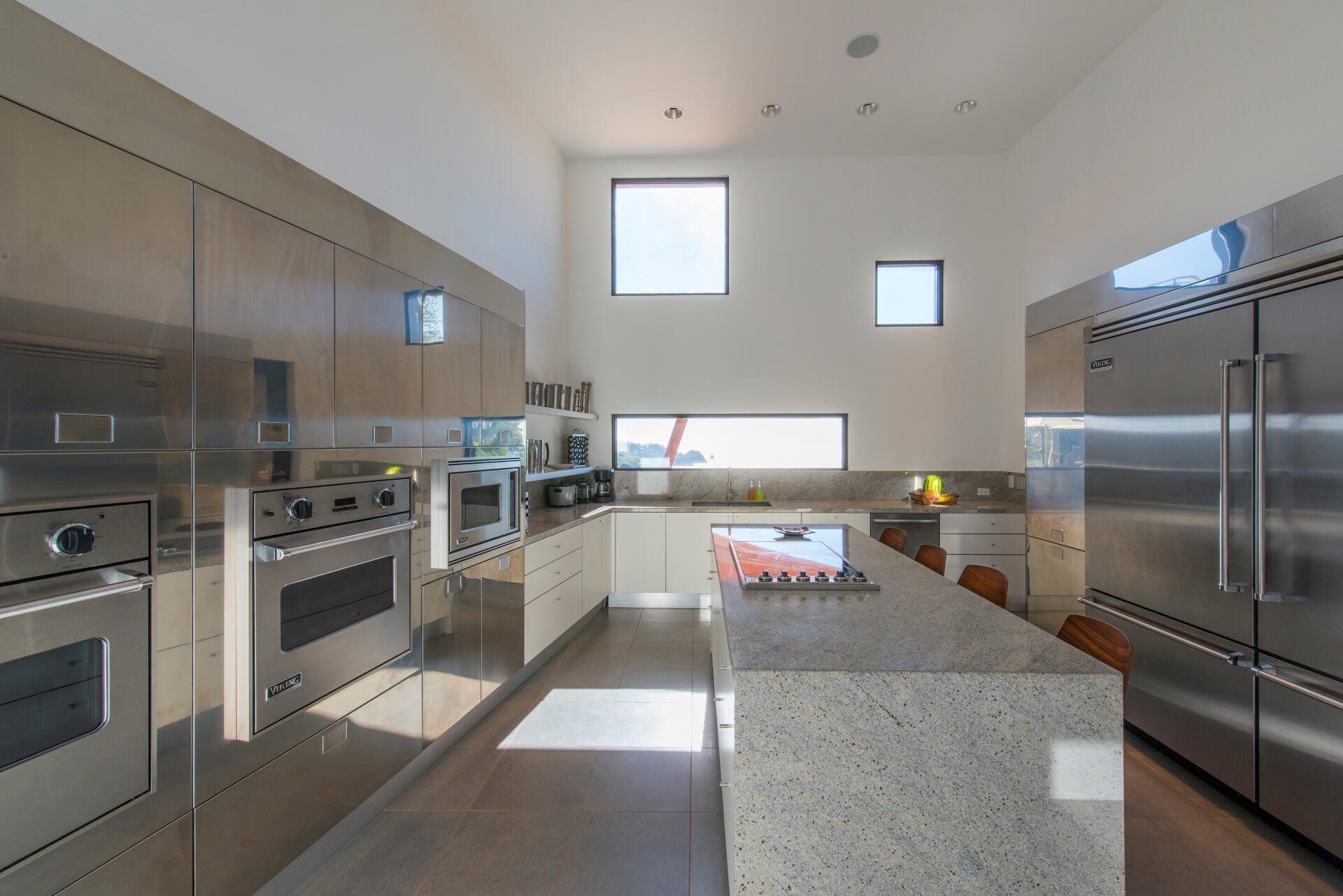 a kitchen with stainless steel appliances and granite counter tops