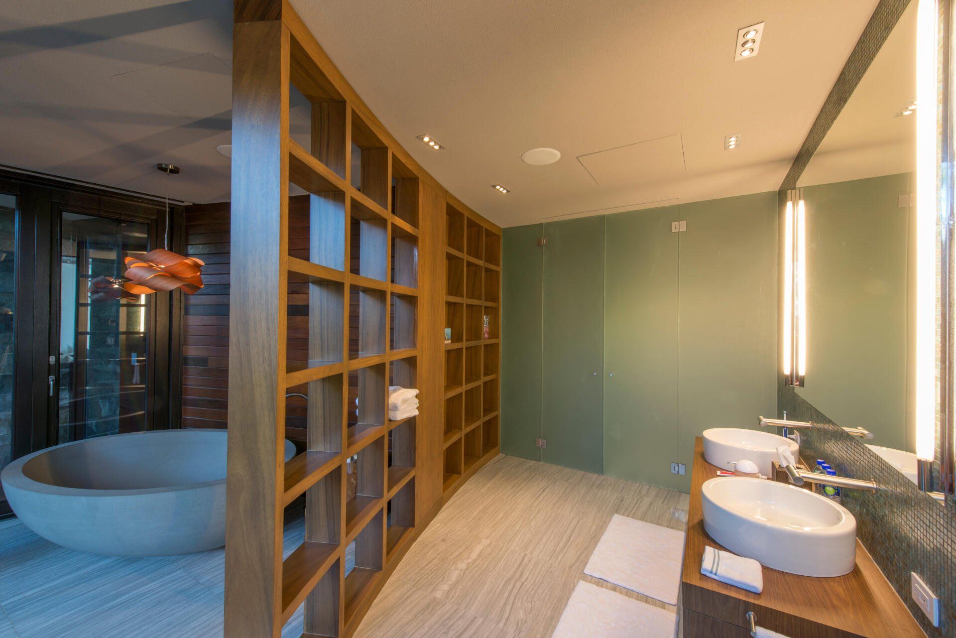 a bathroom with two sinks and a bathtub .