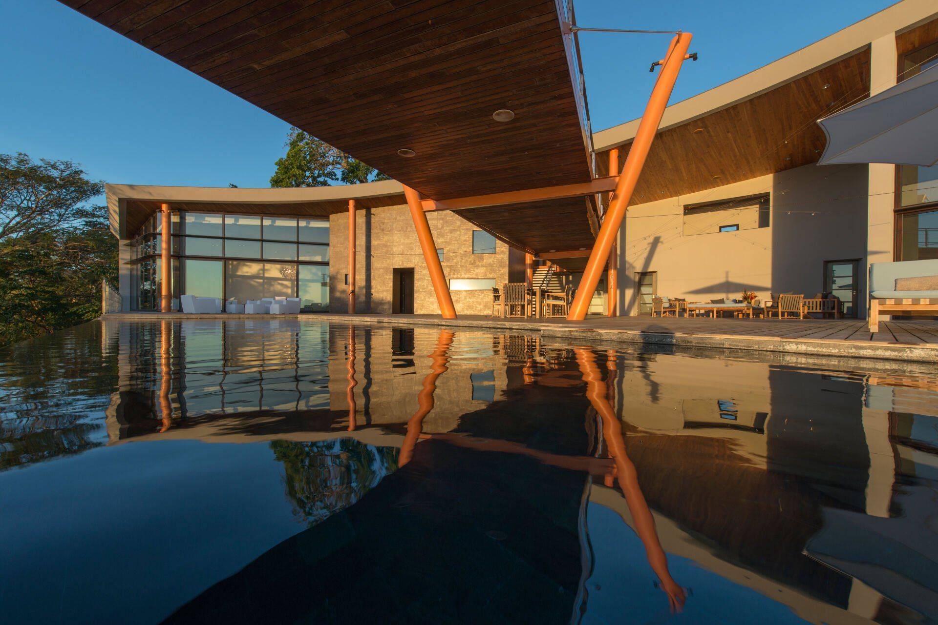 a large house with a swimming pool in front of it