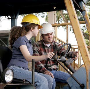 instructor with female truck operator
