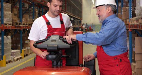 operator being shown forklift controls