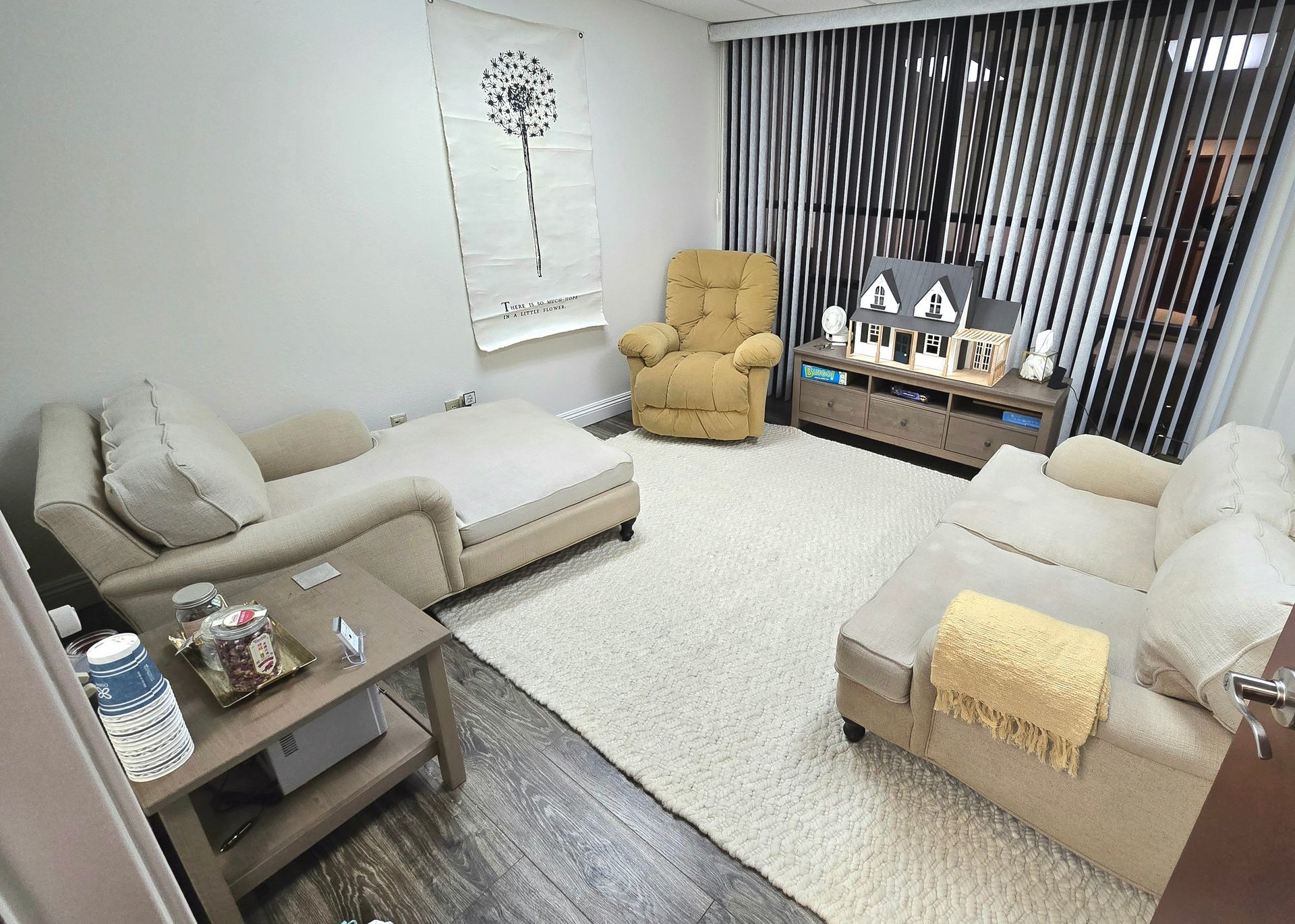 A living room filled with furniture and a television.