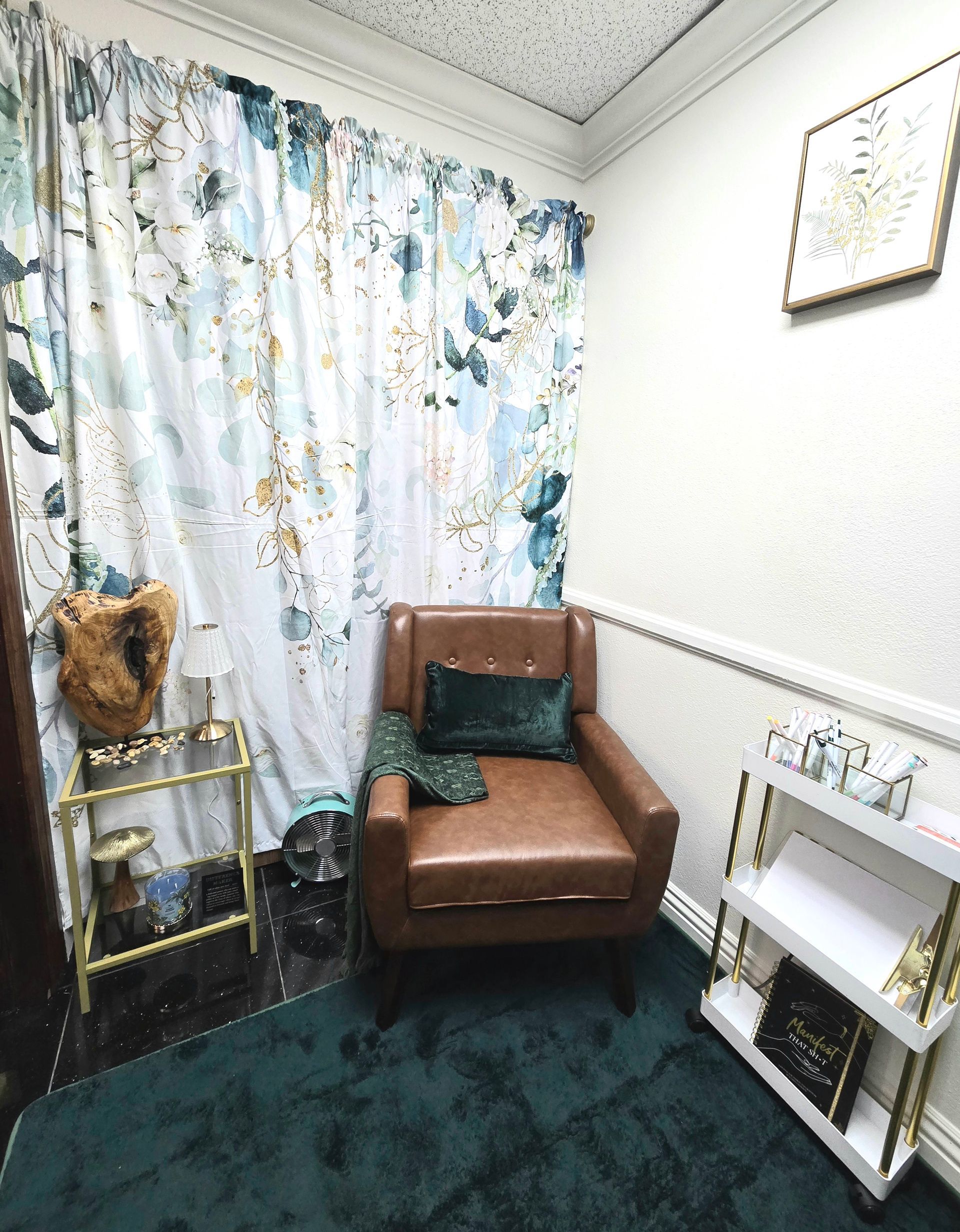 A room with a chair and a shelf in it