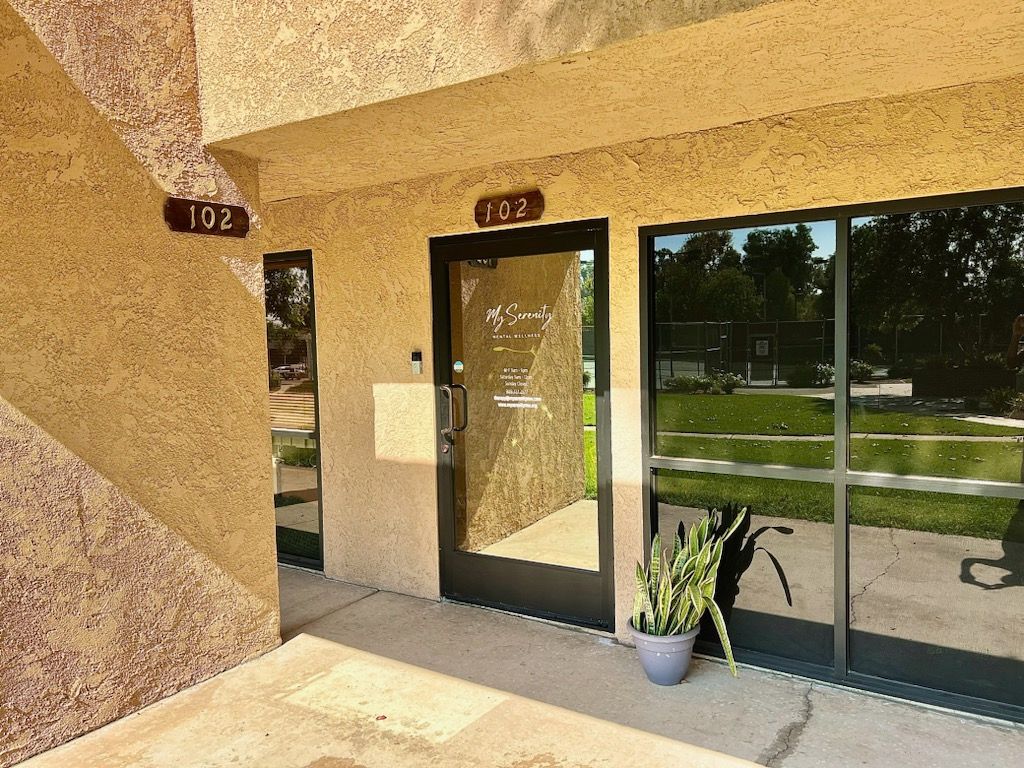 A building with the number 102 on the side of it