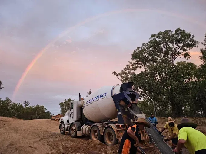 Concrete Truck Pouring Cement at a Construction Site — S & K Raw Materials & Earthmoving in Atherton, QLD