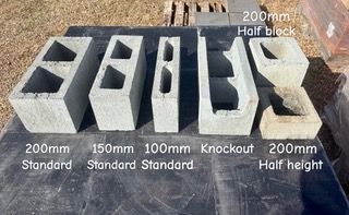 Four Different Colored Bricks Are Stacked On Top Of Each Other — S & K Raw Materials & Earthmoving in Atherton, QLD