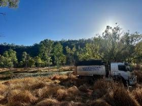 A Tanker Truck Is Parked In Front Of A Building — S & K Raw Materials & Earthmoving in Atherton, QLD