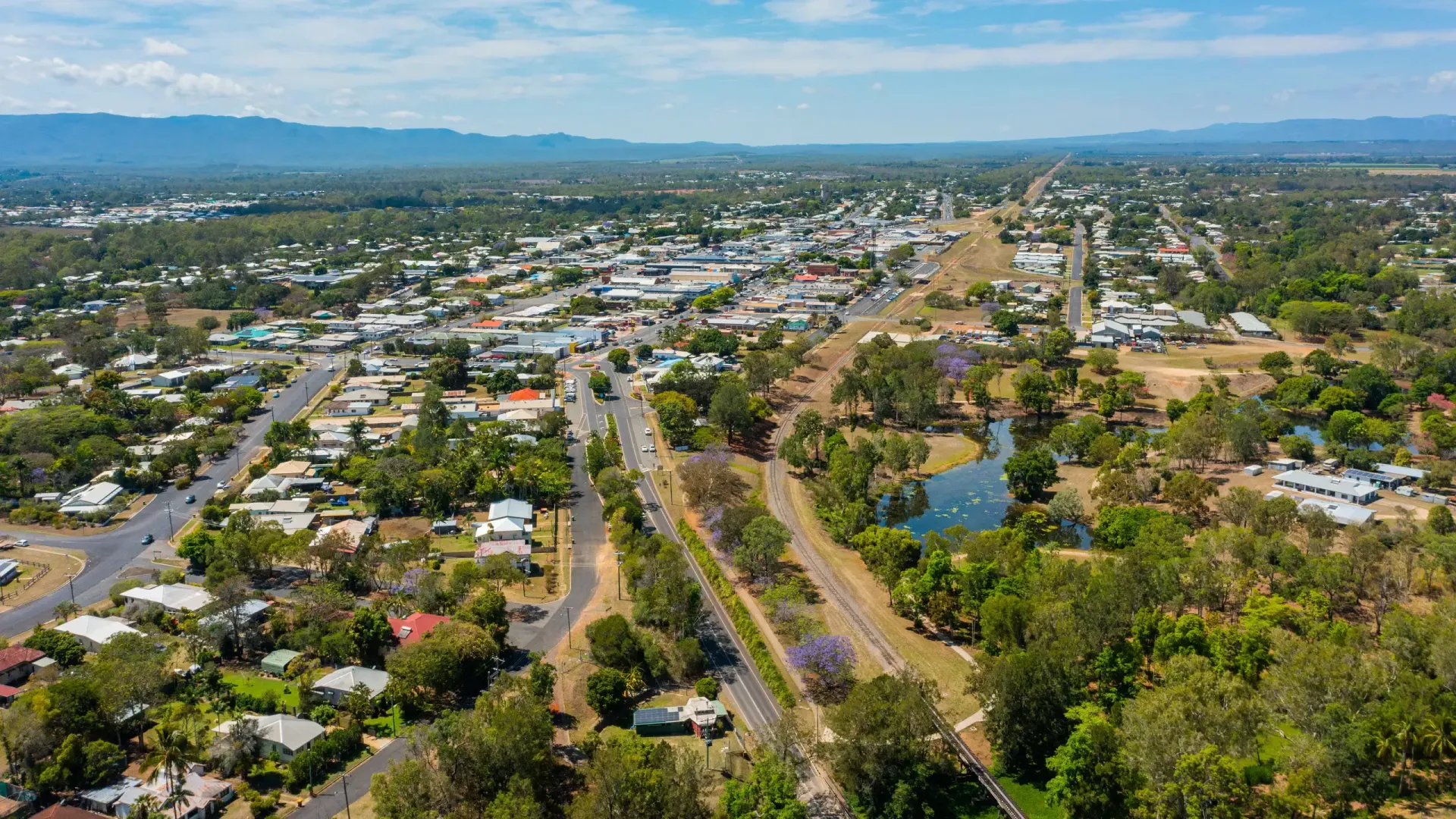 An aerial view of a small town surrounded by trees and mountains — S & K Raw Materials & Earthmoving in Mareeba, QLD