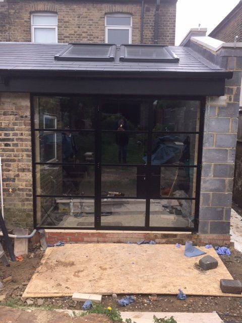 Black metal door with glass