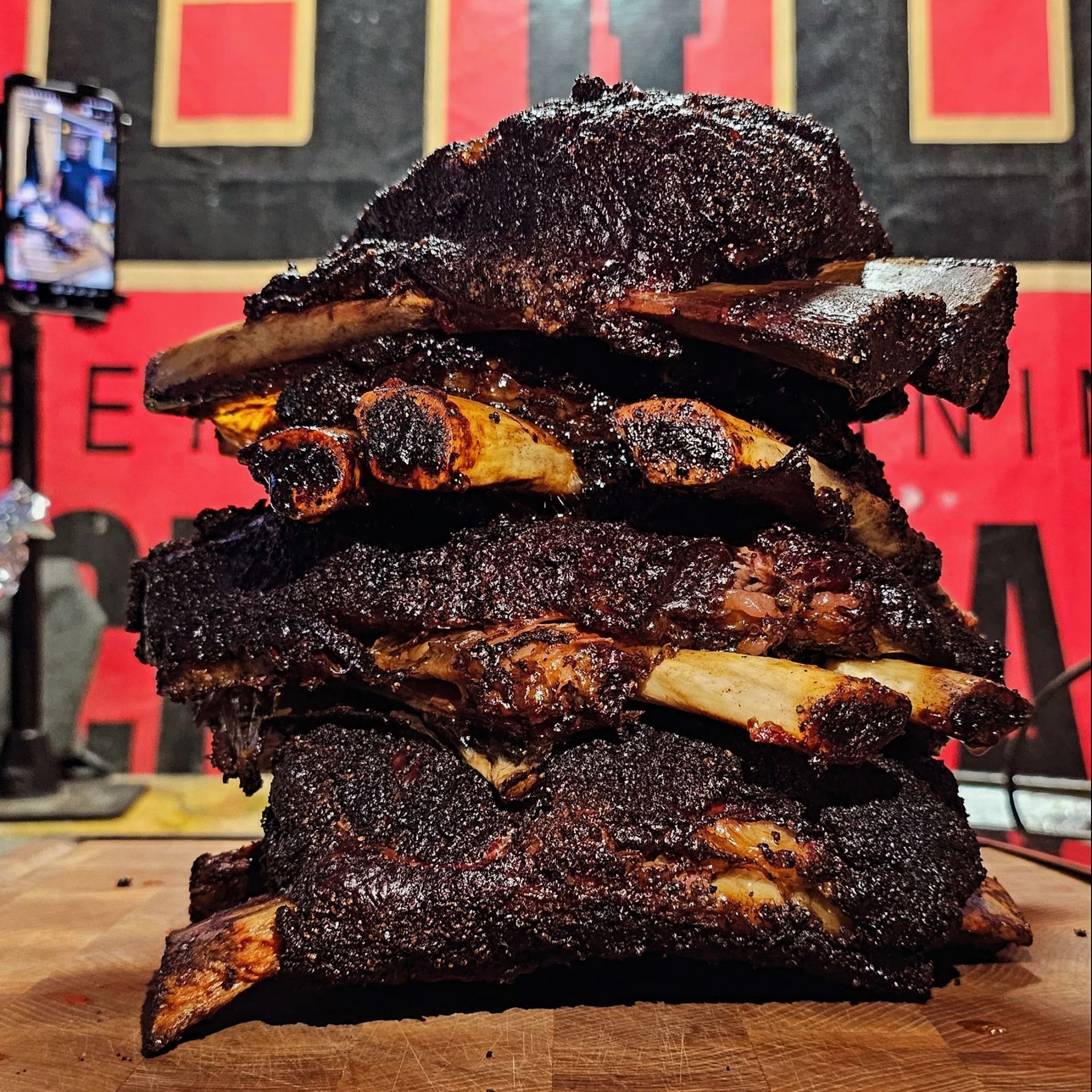 Stack of smoked dino ribs, dark crust, charred edges, best dino ribs recipe