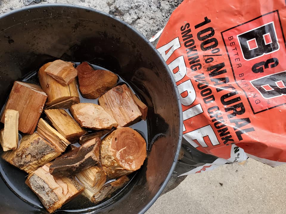 Apple Chunks soaking in bucket next to bag of B&B Apple Chunks from B&B charcoal company