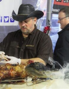 Vic Clevenger serving barbecued alligator
